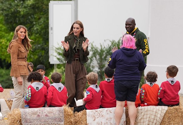 The first lady and the princess meet young scouts accompanied by Chief Scout Dwayne Fields (right).