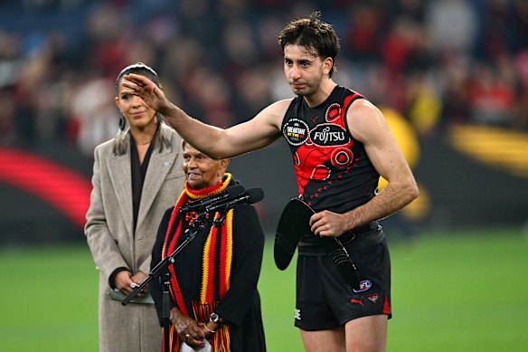 Nic Martin accepts the Yiooken Award as best afield in the Bombers’ last win - against Richmond in the Dreamtime at the ’G game last year.