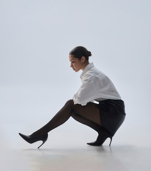 Max Mara shirt. Zara leather shorts. Levante tights. Roger Vivier shoes.