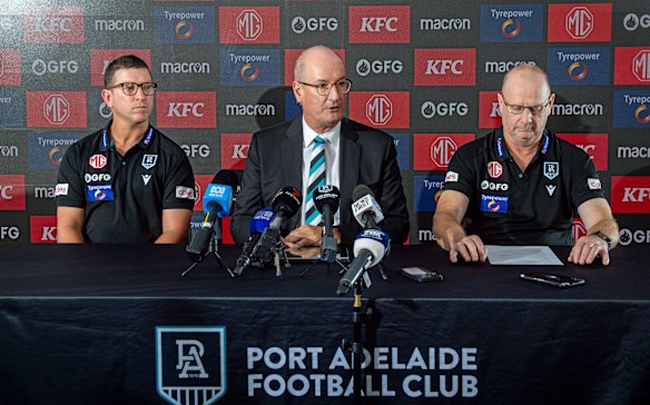 Ken Hinkley (right) has gone, Port Adelaide chairman David Koch (centre) putting his faith in Josh Carr (left) to lead the Power into a new era.