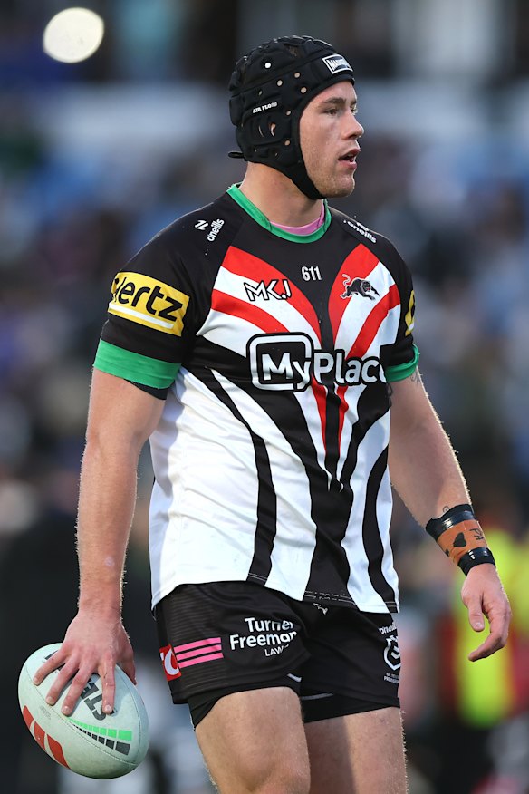Liam Henry warms up ahead of kick-off.