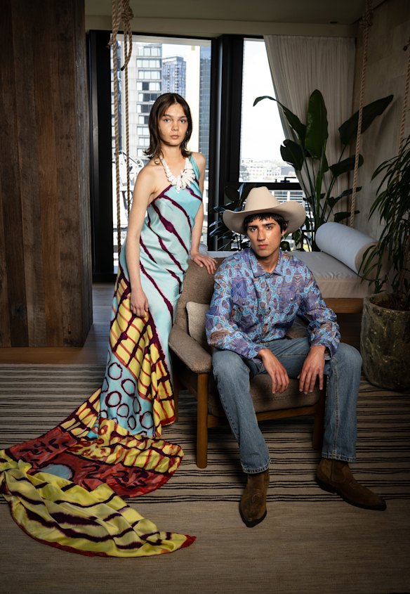 Model Savannah Kruger in Tjarlirli Art dress and Goompi’s Girl necklace and Tarik Ismat in Jaru Girl for Melbourne Fashion Week.