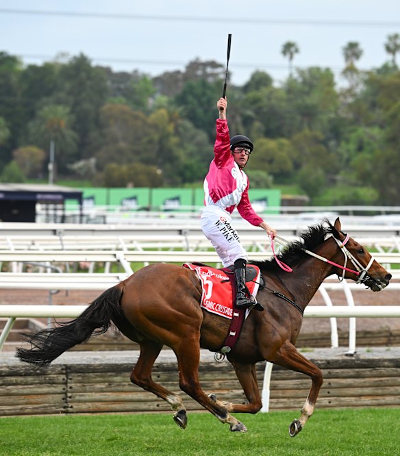 The salute: William Pike after passing the finishing post.