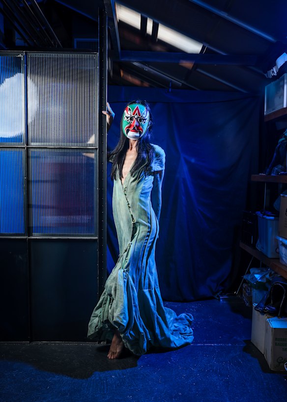 Jackie, who typically wears a face covering for public-facing events, in a dress from her 2023 Australian Fashion Week runway collection.