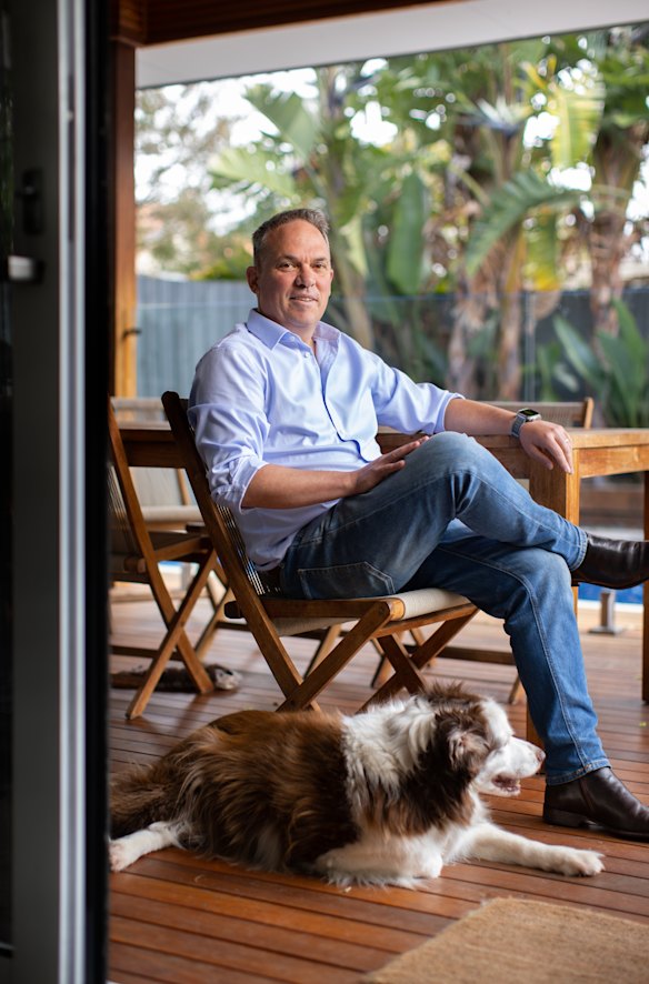 Mark Norris at home in Melbourne with his 14-year-old border collie, Millie. 