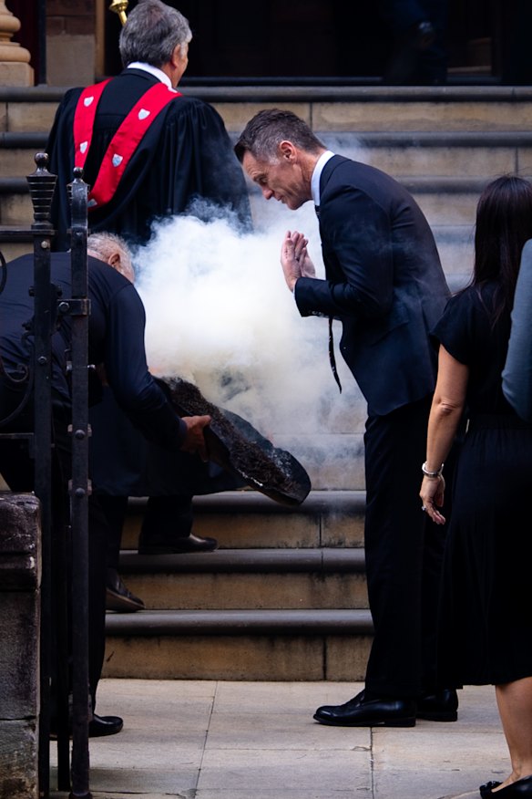 Premier Chris Minns at a smoking ceremony for Dame Marie Bashir outside the church.