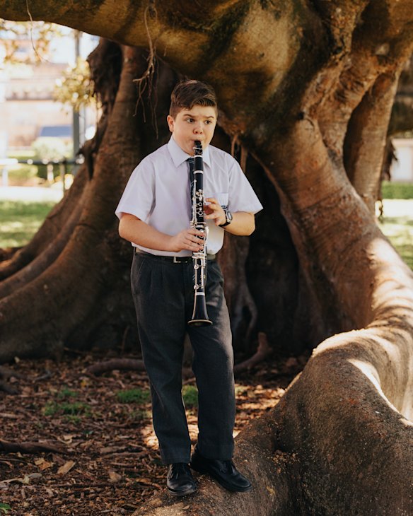 artists Year 7 student Luca Squire playing his clarinet in the Botanic Gardens, which borders the school.