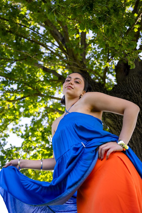 RISSA dressed in her trademark layered outfits.