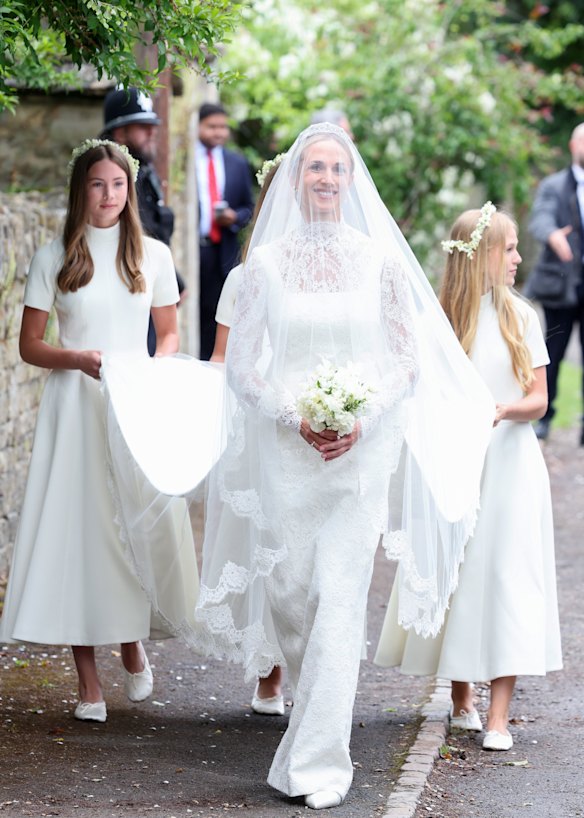 The bride’s dress was designed by Emilia Wickstead and her train was carried by Peter Phillips’ daughters, Savannah and Isla.