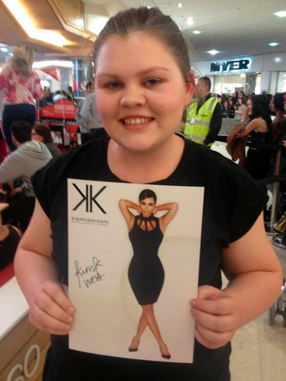 Georgia Mills from Cronulla shows off Kim Kardashian’s autograph a decade ago.