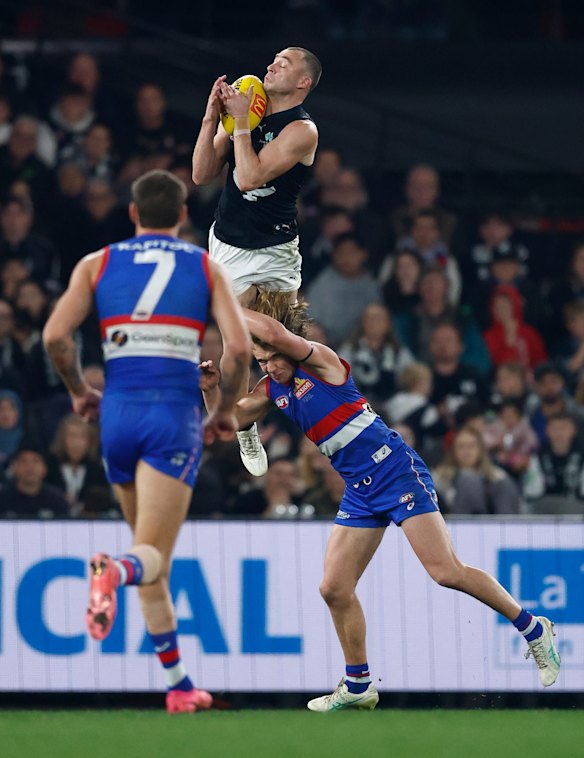Will Hayward soared onto Bulldog Ryley Sanders’ shoulders.