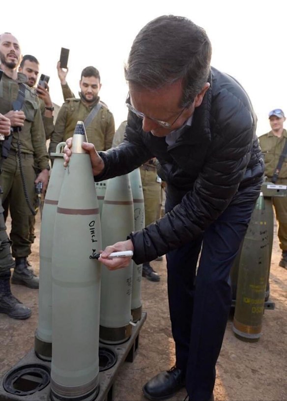 Israeli President Isaac Herzog was criticised for signing a bomb that may have been used in Gaza. The image was widely shared on social media. He says he signed a “smokescreen shell”.