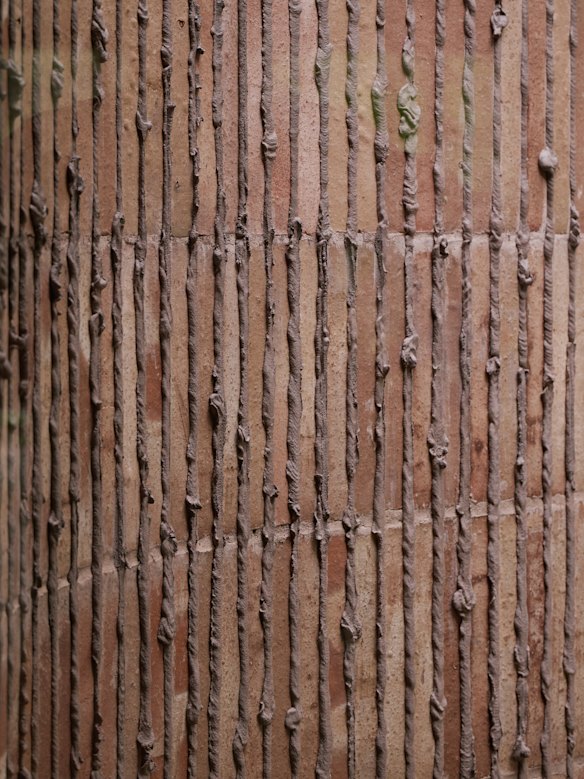Unorthodox mortaring mimics the bark of nearby elm trees.