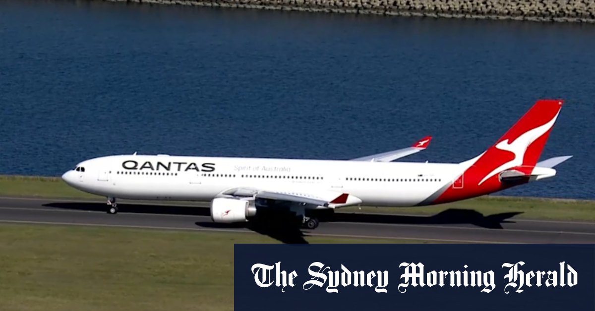 Qantas suspends all flights to Hong Kong as a typhoon barrels towards the region