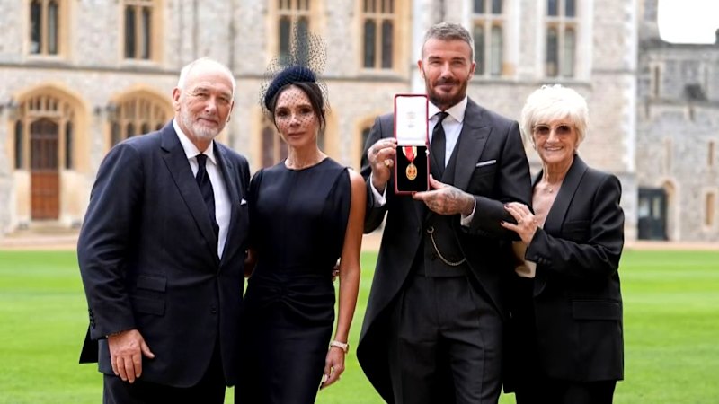 David Beckham kneels before King Charles at knighting ceremony