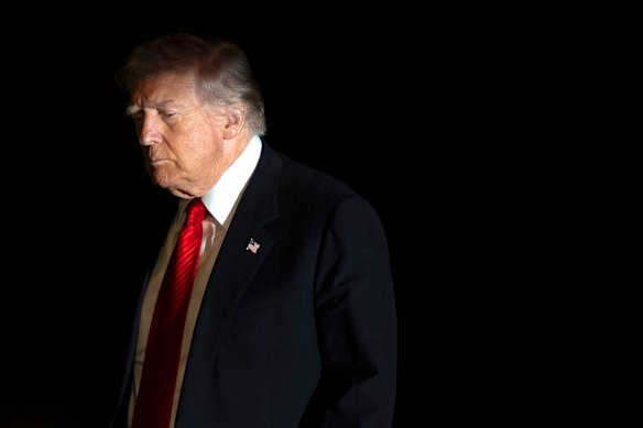 Donald Trump walks across the South Lawn of the White House on Sunday.