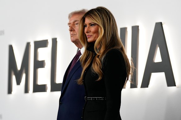 President Donald Trump and first lady Melania Trump arrive for the premiere of her documentary movie in Washington. 