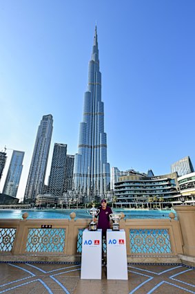 Alex Popyrin with the Australian Open trophies in front of the Burj Khalifa in Dubai.