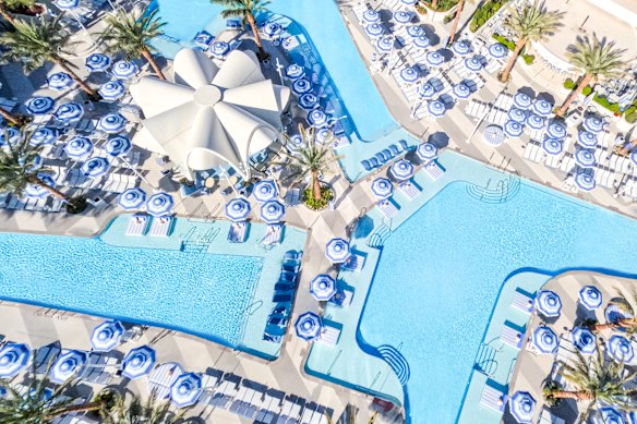 By day, interlocking pools, cabanas and daybeds are sought-after spots for relaxation.