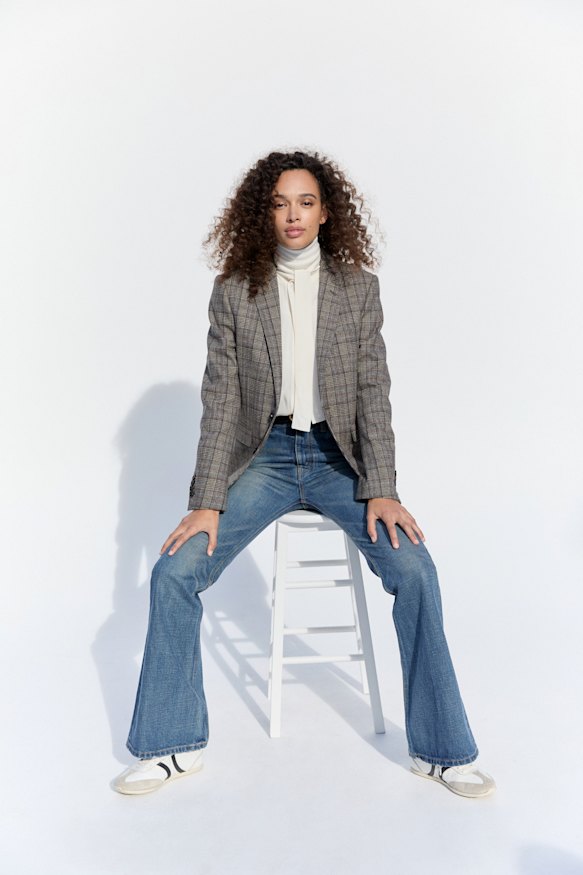 Celine cashmere jacket, POA, silk blouse, POA, “Marco” jeans, $1700, and sneakers, $1350.