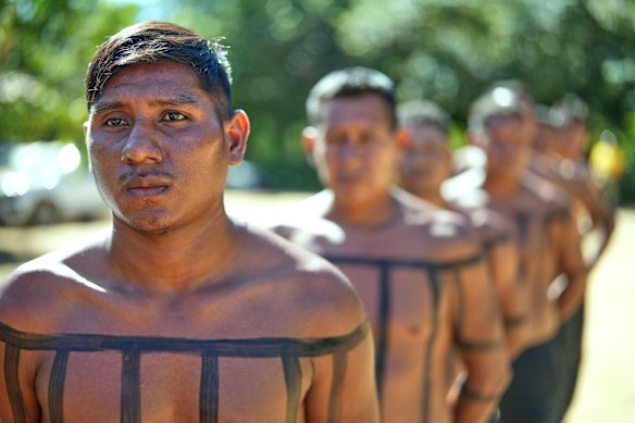 Xerente Indigenous firefighters stand during a fire prevention operation along Brazil's environmental protection agency, IBAMA, at the Xerente territory, near Tocantinia, Tocantins state, Brazil.