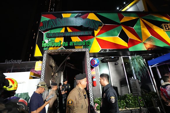 Rescuers and others at the site of the blaze.