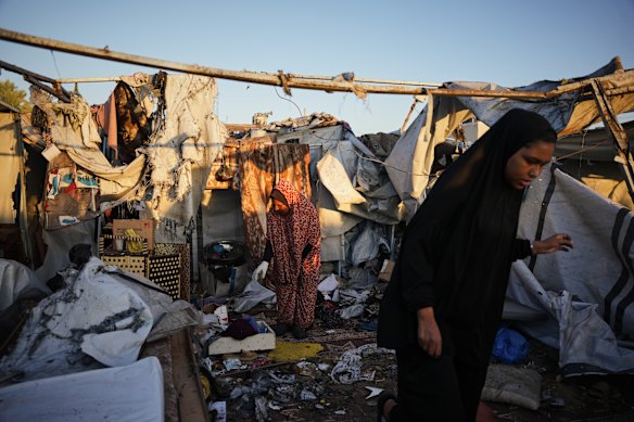 Displaced Palestinians inspect the damage after an Israeli army strike on their tent camp in Deir al-Balah, Gaza Strip, on Wednesday.