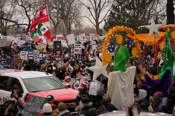 Protesters in Minneapolis on Sunday AEDT gather during a rally for Renee Good, who was fatally shot by an ICE officer last week.