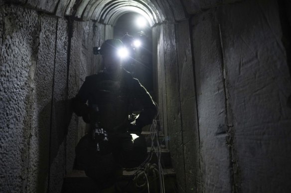 Israeli soldiers show journalists an underground tunnel  in Khan Younis, Gaza Strip, where the Israeli military said it had found evidence hostages were held by militants.