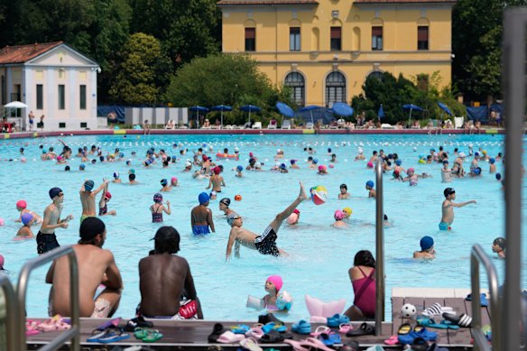 People cool off at the Piscina Romano in Milan.