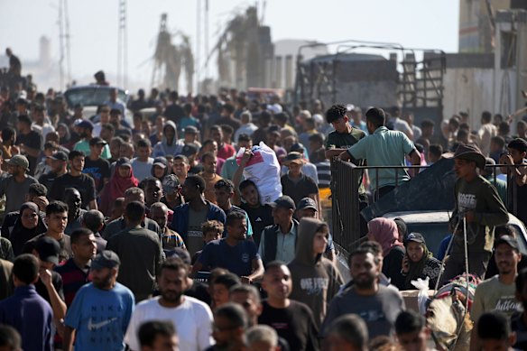 Palestinians heading to receive food and humanitarian aid packages from the Gaza Humanitarian Foundation, a US-backed group approved by Israel, in Rafah, southern Gaza Strip on Tuesday.