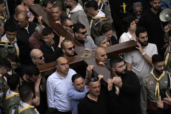 Christians walk the Way of the Cross procession that commemorates Jesus Christ’s crucifixion on Good Friday, in the Old City of Jerusalem.