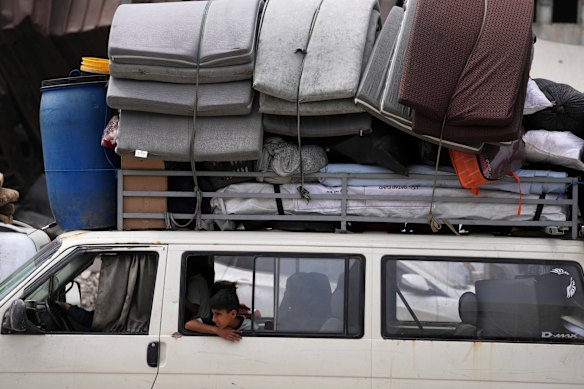 Displaced Palestinians fleeing Beit Lahia amid ongoing Israeli military operations in the Gaza Strip arrive in Jabalia, northern Gaza, on Sunday.