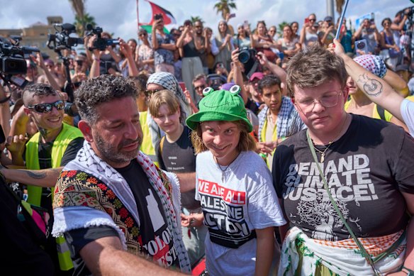 Swedish climate activist Greta Thunberg, centre, before boarding a boatin Barcelona, part of a civilian flotilla bound for Gaza to break the Israeli blockade and deliver humanitarian aid.