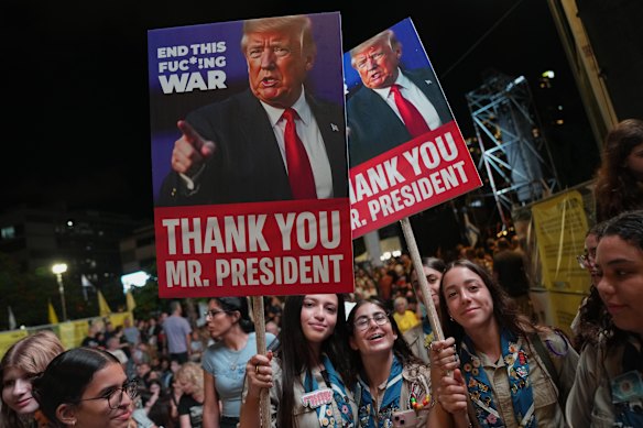 Holding up signs with images depicting the U.S. President Donald Trump, people take part in a rally in support of hostages kidnapped by Hamas, at a plaza known as hostages square in Tel Aviv, Israel.