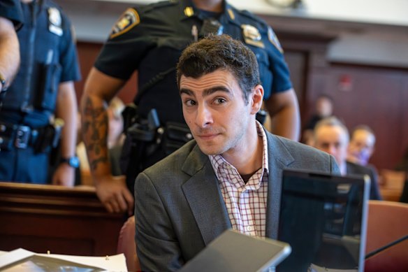Luigi Mangione, centre, appears in court for an evidence hearing in New York overnight.