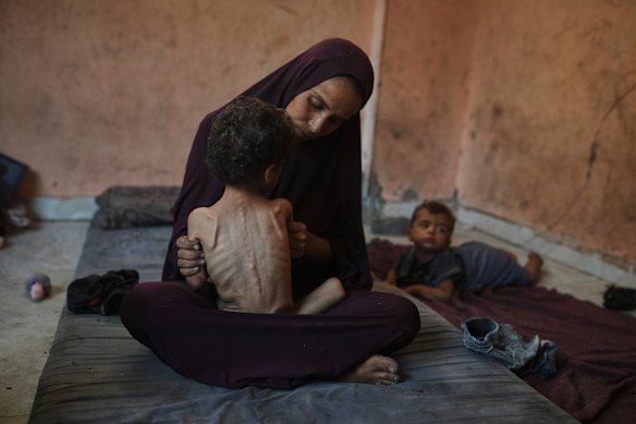 Naima Abu Ful and her two-year-old Yazan in the Shati refugee camp in Gaza City on July 23.