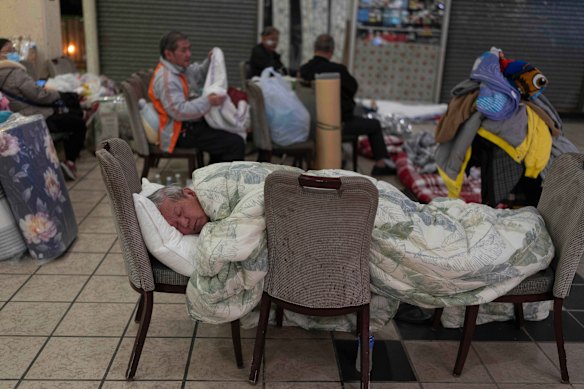Residents seeks shelter in a nearby shopping centre in the aftermath of the fire.