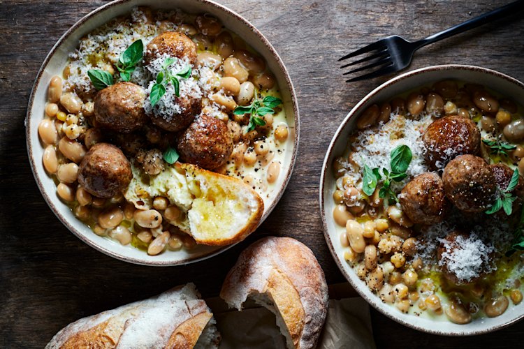 Creamy braised beans with lamb meatballs.