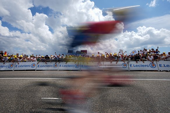 Spectators look at the breakaway during the fourteenth stage of the Tour de France cycling race with start in Mulhouse and finish in Le Markstein Fellering, France.