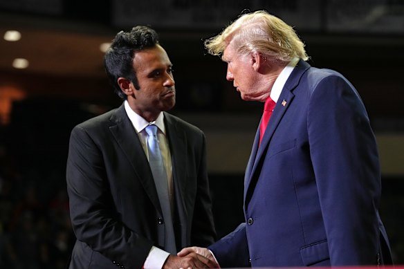 President Donald Trump shakes hands with gubernatorial candidate Vivek Ramaswamy at a rally in Ohio.