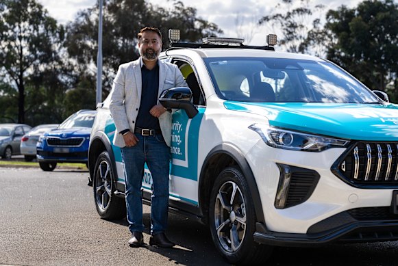 Wyndham city councillor Preet Singh, with one of the private security patrol cars that will operate within Truganina. 
