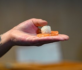 Place a small ball of rice on the fish when making nigiri.