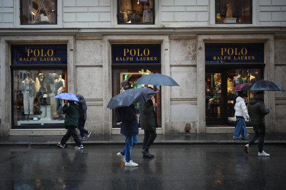 Shoppers and tourists walk past the US-owned Polo Ralph Lauren store in Rome. The EU announced that, from April 1, it would impose tariffs on iconic American products such as Harley-Davidson motorcycles, bourbon and jeans.