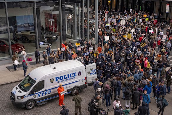 Demonstrators are arrested during a protest against Elon Musk and Tesla outside a Tesla showroom in New York in March.