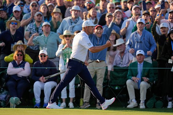 Bryson DeChambeau celebrates after a birdie on the 18th hole.