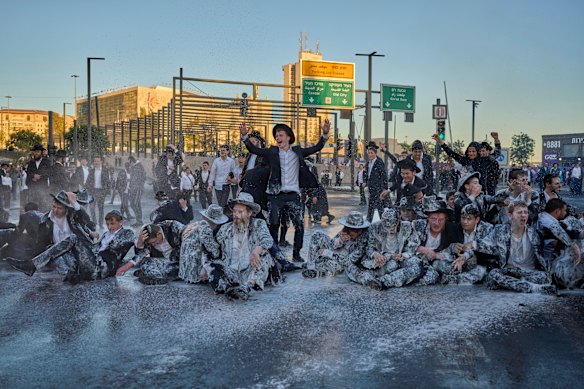 Israeli mounted police disperse Ultra-Orthodox Jews blocking a road during a protest against the army draft in Jerusalem.