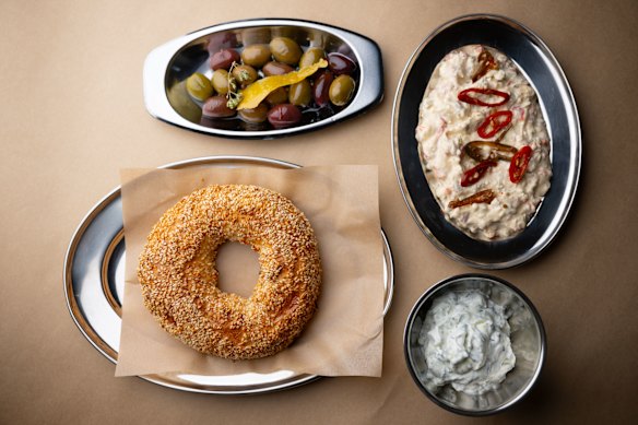 Koulouri with tzatziki, olives and tirokafteri.