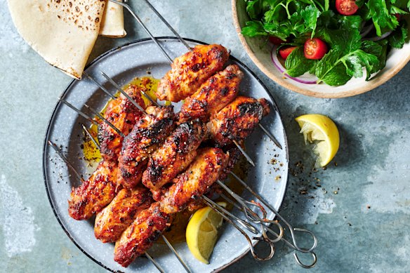 Kanat chicken wings with sumac, tomato and onion salad.