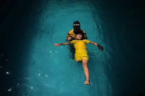 Palestinian girl Miral al-Babli, who lost a leg after being injured during the war between Israel and Hamas, receives swimming training from the Heal Palestine organization at a pool in Khan Younis, Gaza Strip.